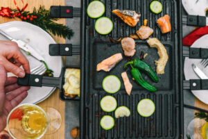 raclette grill on wooden table