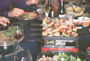 table where people are dining with a raclette grill